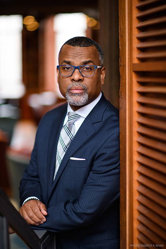 Eddie Glaude Jr. standing for a portrait